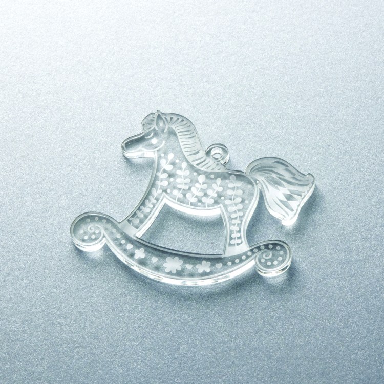 Laser cut and engraved transparent acrylic Christmas ornament.