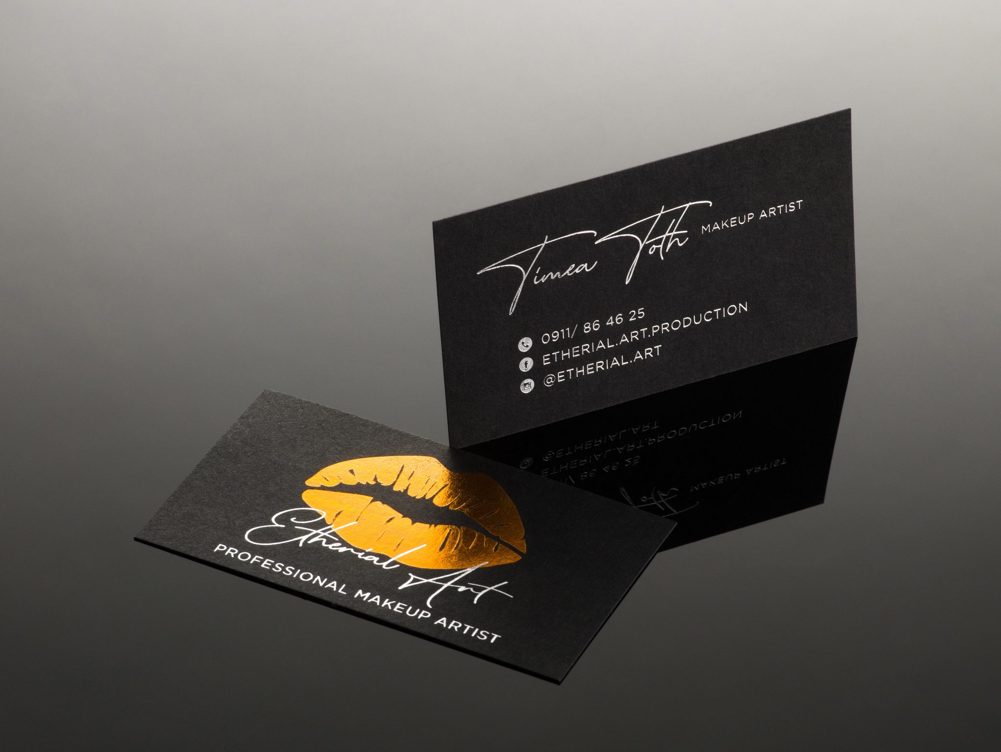 Business card with silver and copper foiling on Black Smooth paper